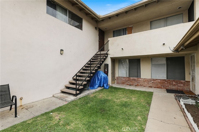 12071 Laguna St, Garden Grove, CA 92840 - exterior space featuring stucco siding, brick siding, and a yard