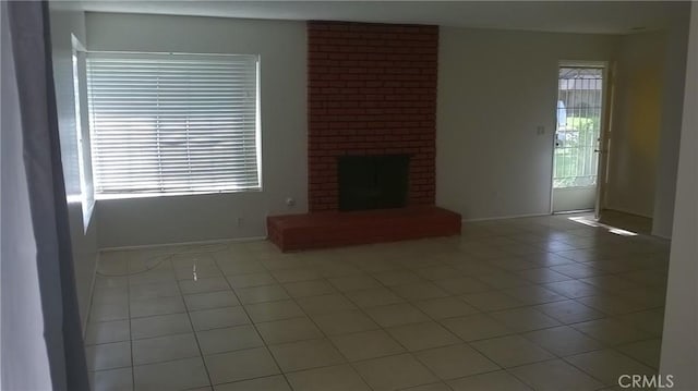 12071 Laguna St, Garden Grove, CA 92840 - unfurnished living room featuring light tile patterned flooring and a fireplace