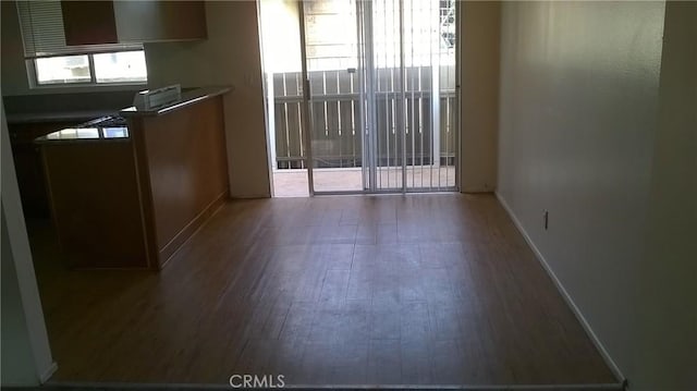 12071 Laguna St, Garden Grove, CA 92840 - unfurnished dining area with wood finished floors and plenty of natural light
