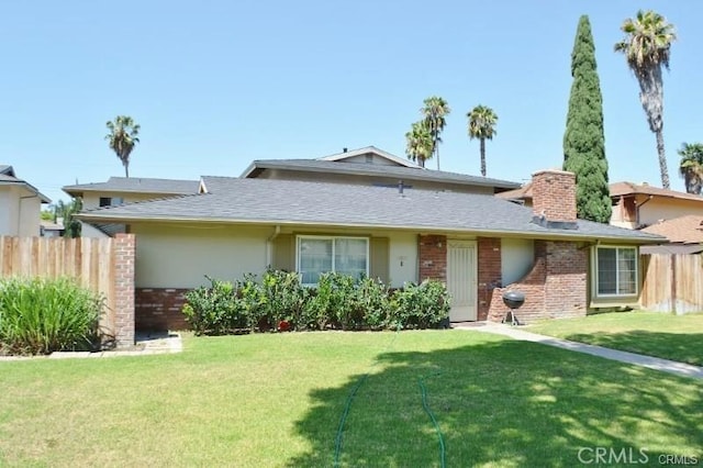12071 Laguna St, Garden Grove, CA 92840 - view of front of property with a chimney, brick siding, and stucco siding