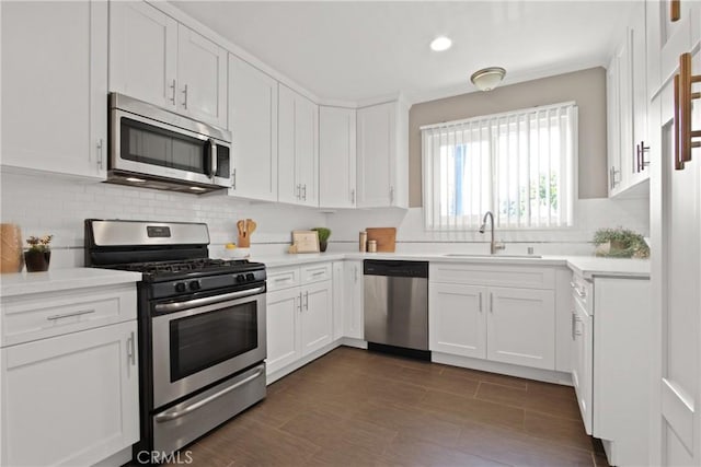1327 E Appleton St Unit 1, Long Beach, CA 90802 - kitchen featuring stainless steel appliances, white cabinetry, tasteful backsplash, light countertops, and recessed lighting