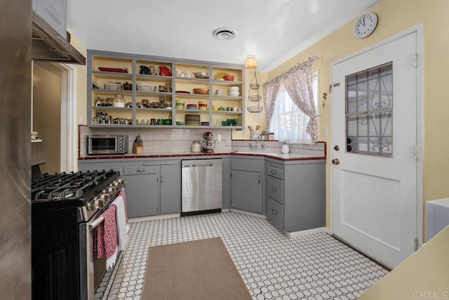 4886 Twain Ave, San Diego, CA 92120 - kitchen with appliances with stainless steel finishes, gray cabinets, ventilation hood, and tile countertops
