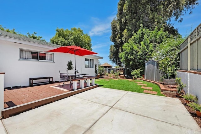 4886 Twain Ave, San Diego, CA 92120 - fenced backyard featuring a storage shed, a patio, outdoor dining space, and a wooden deck