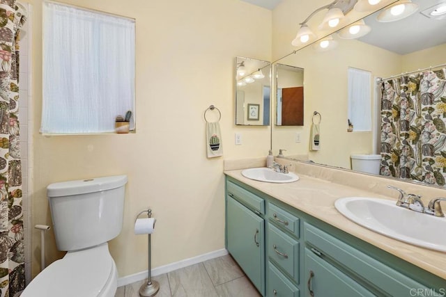 4886 Twain Ave, San Diego, CA 92120 - bathroom featuring double vanity and marble look tile flooring
