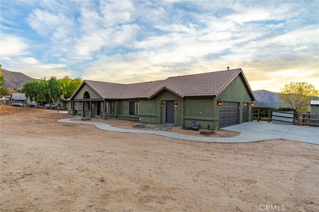 32175 Cedarcroft Rd, Acton, CA 93510 - ranch-style house featuring a garage, a mountain view, stucco siding, a tile roof, and concrete driveway