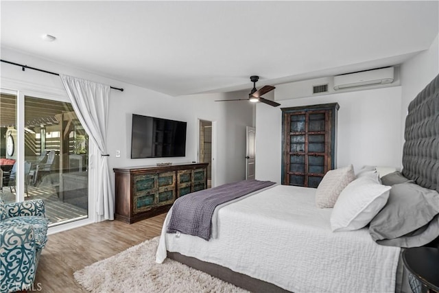 32175 Cedarcroft Rd, Acton, CA 93510 - bedroom with a wall mounted AC, access to outside, wood finished floors, and ceiling fan