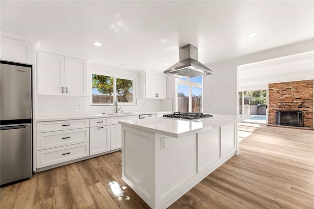 2038 Noble View Dr, Rancho Palos Verdes, CA 90275 - kitchen with stainless steel appliances, island range hood, healthy amount of natural light, a kitchen island, and recessed lighting