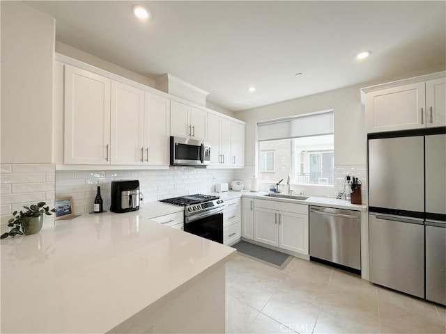 3700 Verdana Cir, La Verne, CA 91750 - kitchen featuring stainless steel appliances, decorative backsplash, white cabinets, light countertops, and recessed lighting