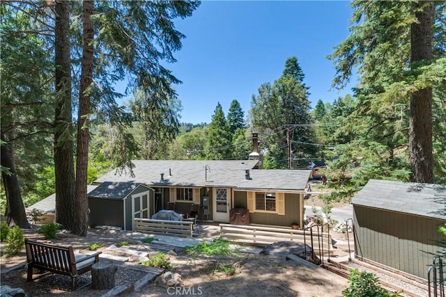 37667 Live Oak St, Angelus Oaks, CA 92305 - back of house featuring a shed and a chimney
