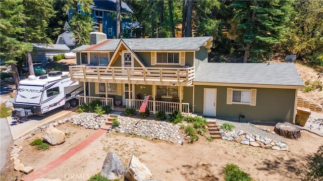 37667 Live Oak St, Angelus Oaks, CA 92305 - view of front of house featuring covered porch, a balcony, a chimney, and stucco siding