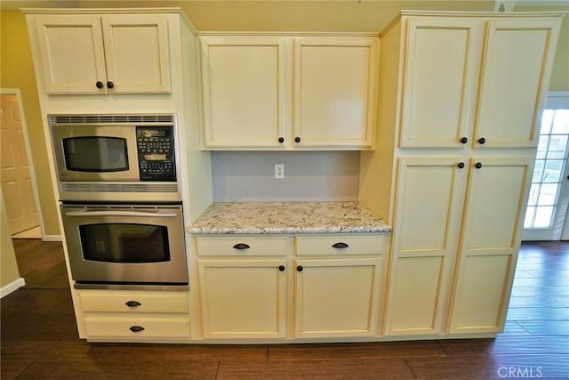 845 E Redwood Cir, Hanford, CA 93230 - kitchen with appliances with stainless steel finishes, dark wood-style floors, and light stone countertops