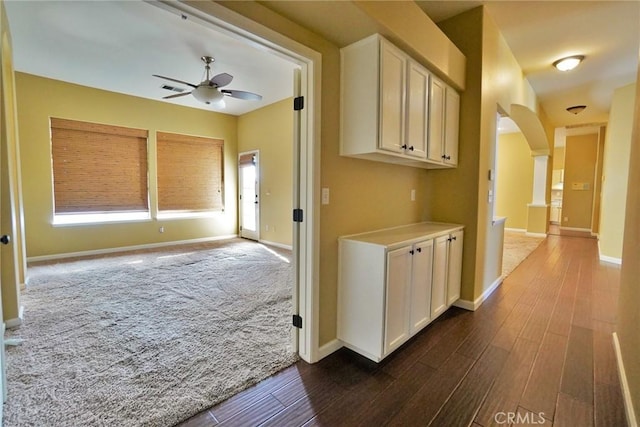 845 E Redwood Cir, Hanford, CA 93230 - hallway featuring dark wood-type flooring and arched walkways