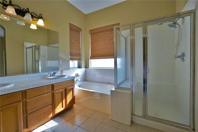 845 E Redwood Cir, Hanford, CA 93230 - full bathroom with a bath, double vanity, a stall shower, and tile patterned flooring