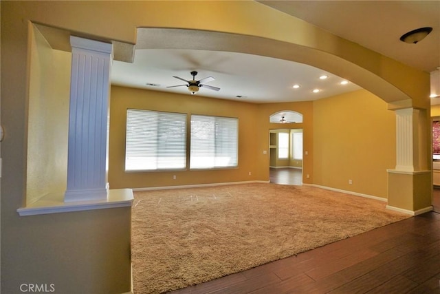 845 E Redwood Cir, Hanford, CA 93230 - unfurnished living room featuring ornate columns, a ceiling fan, wood finished floors, arched walkways, and recessed lighting