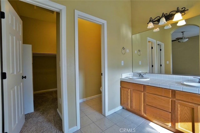 845 E Redwood Cir, Hanford, CA 93230 - bathroom with double vanity, tile patterned flooring, and ceiling fan