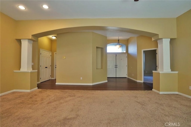 845 E Redwood Cir, Hanford, CA 93230 - carpeted empty room with arched walkways, decorative columns, and recessed lighting