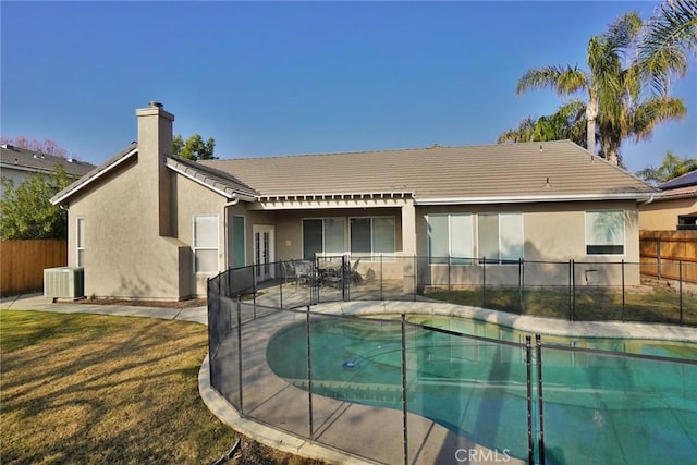 845 E Redwood Cir, Hanford, CA 93230 - rear view of property with a chimney, a tile roof, stucco siding, and a patio