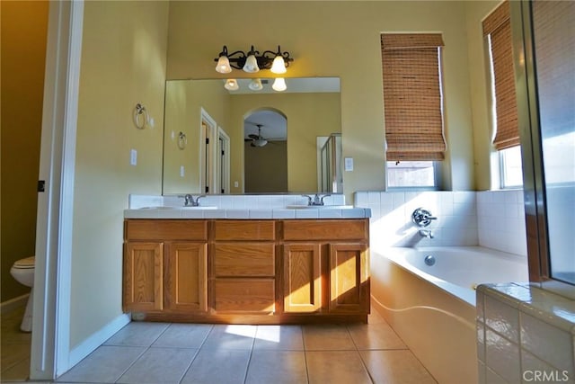 845 E Redwood Cir, Hanford, CA 93230 - bathroom featuring ceiling fan, a bath, double vanity, and tile patterned floors