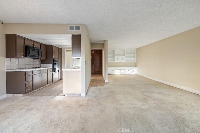 5870 Green Valley Cir Unit 231, Culver City, CA 90230 - unfurnished living room with light colored carpet and a textured ceiling