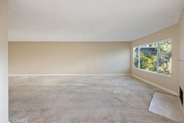5870 Green Valley Cir Unit 231, Culver City, CA 90230 - carpeted empty room with a textured ceiling and baseboards