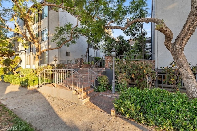 5870 Green Valley Cir Unit 231, Culver City, CA 90230 - view of side of home with stucco siding and stairs