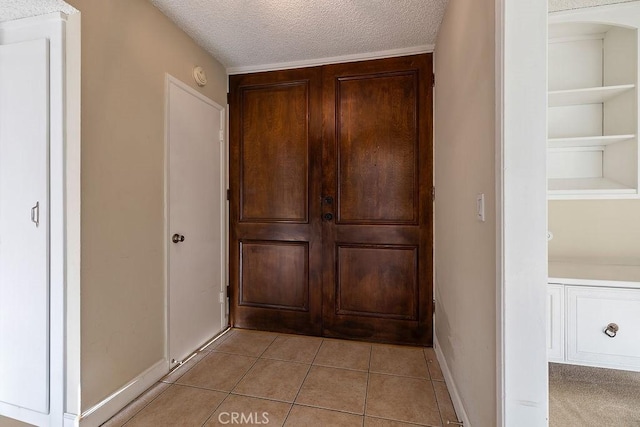 5870 Green Valley Cir Unit 231, Culver City, CA 90230 - hallway with a textured ceiling and light tile patterned floors