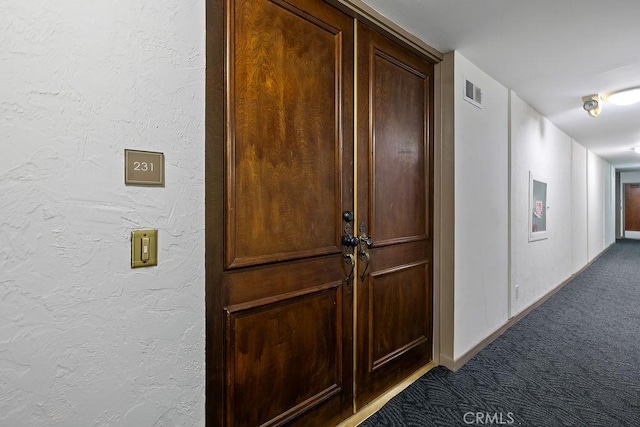 5870 Green Valley Cir Unit 231, Culver City, CA 90230 - hallway with carpet floors and a textured wall
