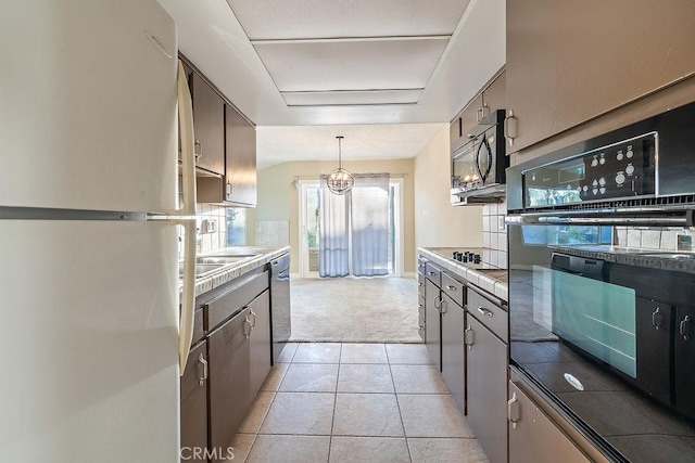 5870 Green Valley Cir Unit 231, Culver City, CA 90230 - kitchen featuring black appliances, light colored carpet, light countertops, and light tile patterned flooring