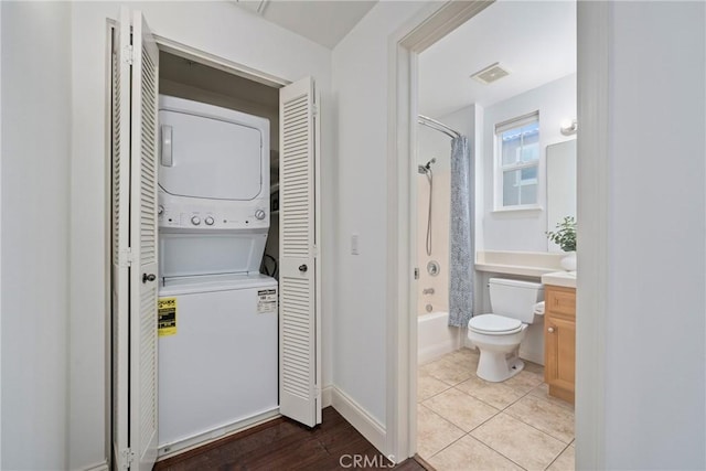 322 Dewdrop, Irvine, CA 92603 - bathroom featuring stacked washer and clothes dryer, shower / bath combo, vanity, a closet, and tile patterned floors
