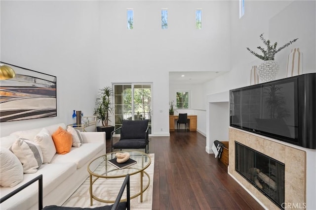 322 Dewdrop, Irvine, CA 92603 - living room with a tiled fireplace, hardwood / wood-style floors, and a high ceiling