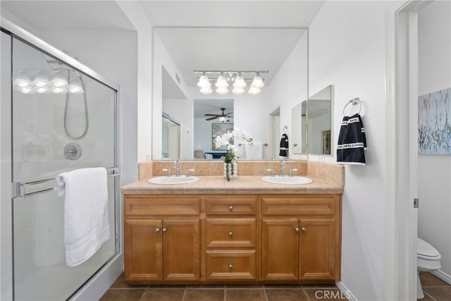 322 Dewdrop, Irvine, CA 92603 - bathroom featuring double vanity, a stall shower, ceiling fan, and tile patterned floors