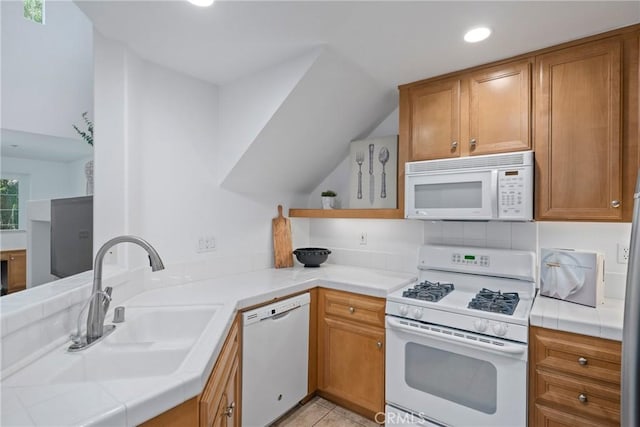 322 Dewdrop, Irvine, CA 92603 - kitchen featuring white appliances, tile counters, a peninsula, brown cabinets, and recessed lighting