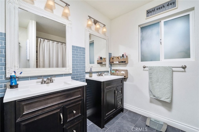 10147 Primrose Ave, Hesperia, CA 92345 - bathroom with backsplash, two vanities, and tile patterned floors