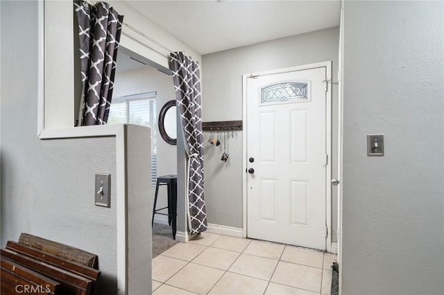10147 Primrose Ave, Hesperia, CA 92345 - tiled entryway with a textured wall and baseboards