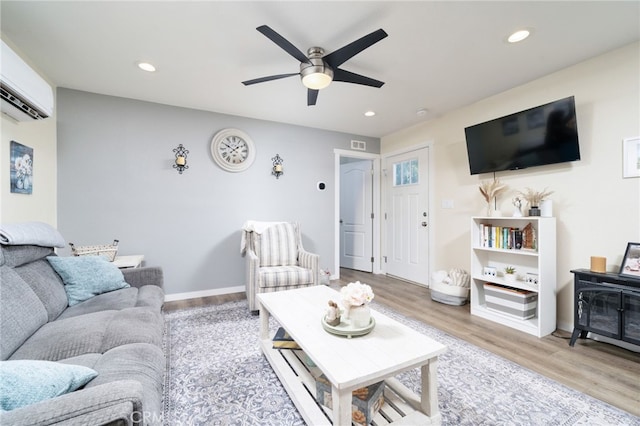 10147 Primrose Ave, Hesperia, CA 92345 - living room featuring wood finished floors, a wall mounted air conditioner, a ceiling fan, and recessed lighting