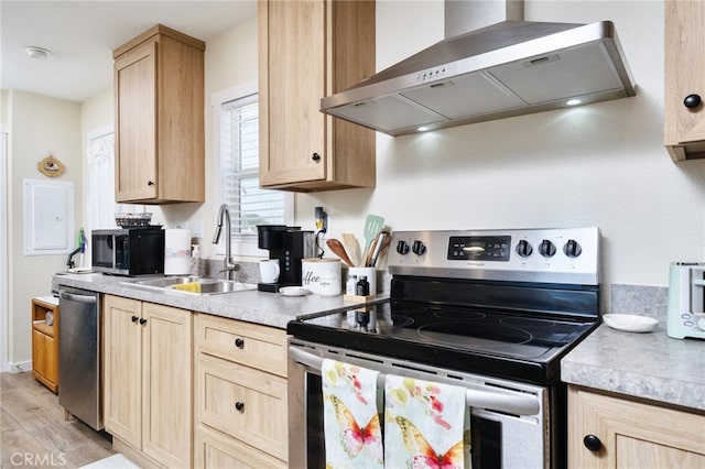 10147 Primrose Ave, Hesperia, CA 92345 - kitchen with range hood, appliances with stainless steel finishes, light brown cabinets, and light countertops