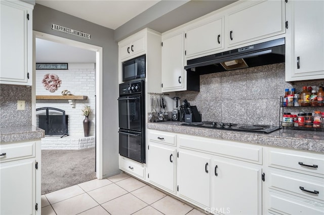 10147 Primrose Ave, Hesperia, CA 92345 - kitchen with light colored carpet, black appliances, under cabinet range hood, white cabinetry, and light tile patterned flooring