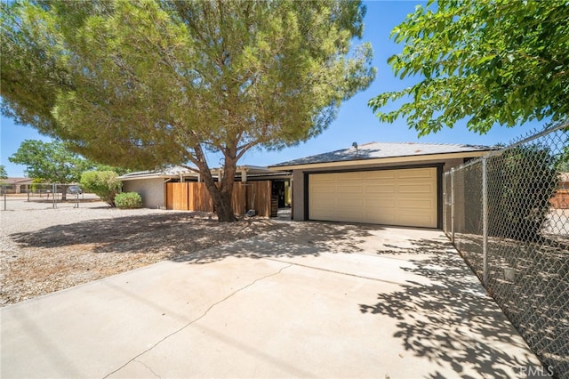10147 Primrose Ave, Hesperia, CA 92345 - view of front facade featuring concrete driveway and an attached garage
