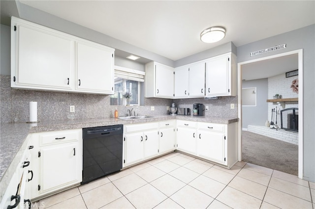 10147 Primrose Ave, Hesperia, CA 92345 - kitchen with black dishwasher, white cabinets, and a brick fireplace