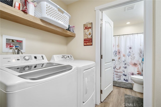 10147 Primrose Ave, Hesperia, CA 92345 - laundry area with washer and clothes dryer, light wood-style flooring, and recessed lighting