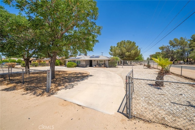 10147 Primrose Ave, Hesperia, CA 92345 - ranch-style home with solar panels and a gate