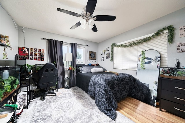 10147 Primrose Ave, Hesperia, CA 92345 - bedroom featuring a desk, wood finished floors, and a ceiling fan