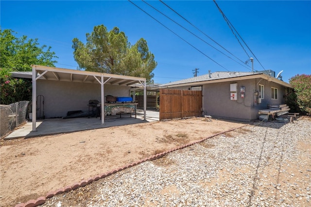 10147 Primrose Ave, Hesperia, CA 92345 - rear view of property with stucco siding and a patio