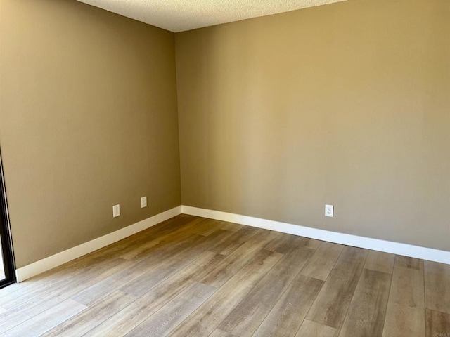 6182 Agee St Unit 193, San Diego, CA 92122 - empty room featuring wood finished floors and a textured ceiling