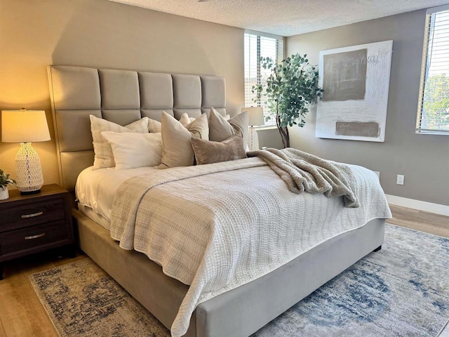 6182 Agee St Unit 193, San Diego, CA 92122 - bedroom featuring wood finished floors and a textured ceiling