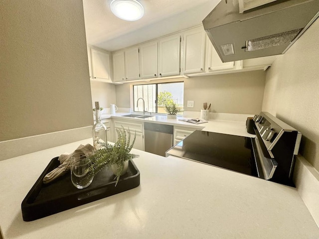 6182 Agee St Unit 193, San Diego, CA 92122 - kitchen with exhaust hood, range with electric cooktop, dishwasher, light countertops, and a textured wall