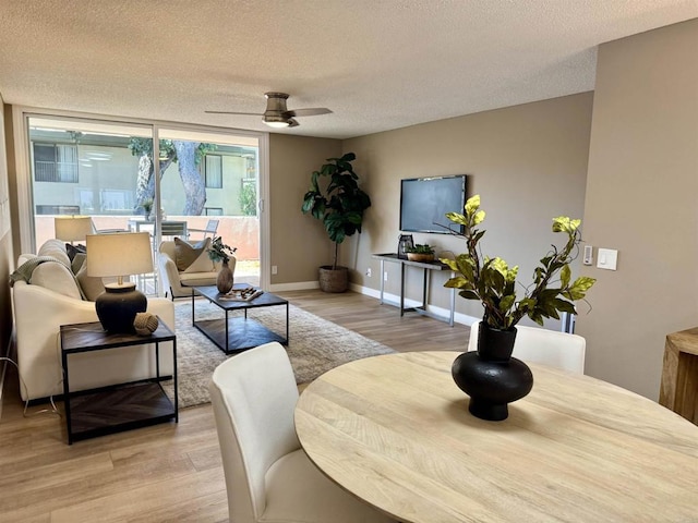 6182 Agee St Unit 193, San Diego, CA 92122 - living room with light wood finished floors, a textured ceiling, and ceiling fan