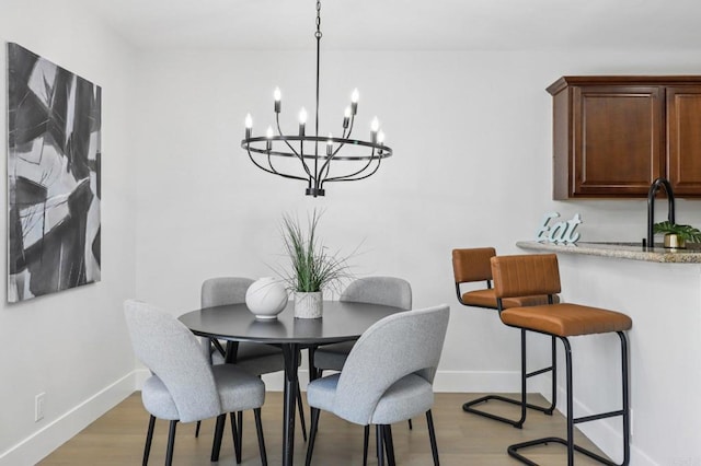 6876 Bear River Row Unit 3, San Diego, CA 92139 - dining room with a chandelier and wood finished floors