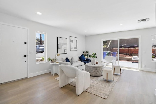 6876 Bear River Row Unit 3, San Diego, CA 92139 - living area featuring light wood-type flooring and recessed lighting