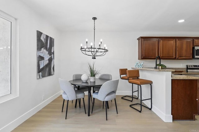 6876 Bear River Row Unit 3, San Diego, CA 92139 - dining space featuring a chandelier, light wood-type flooring, and recessed lighting